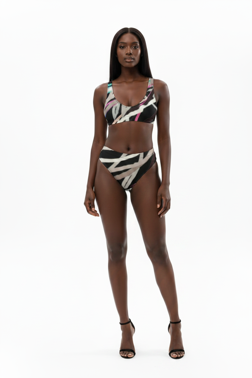 Woman wearing a patterned bikini set on a white background