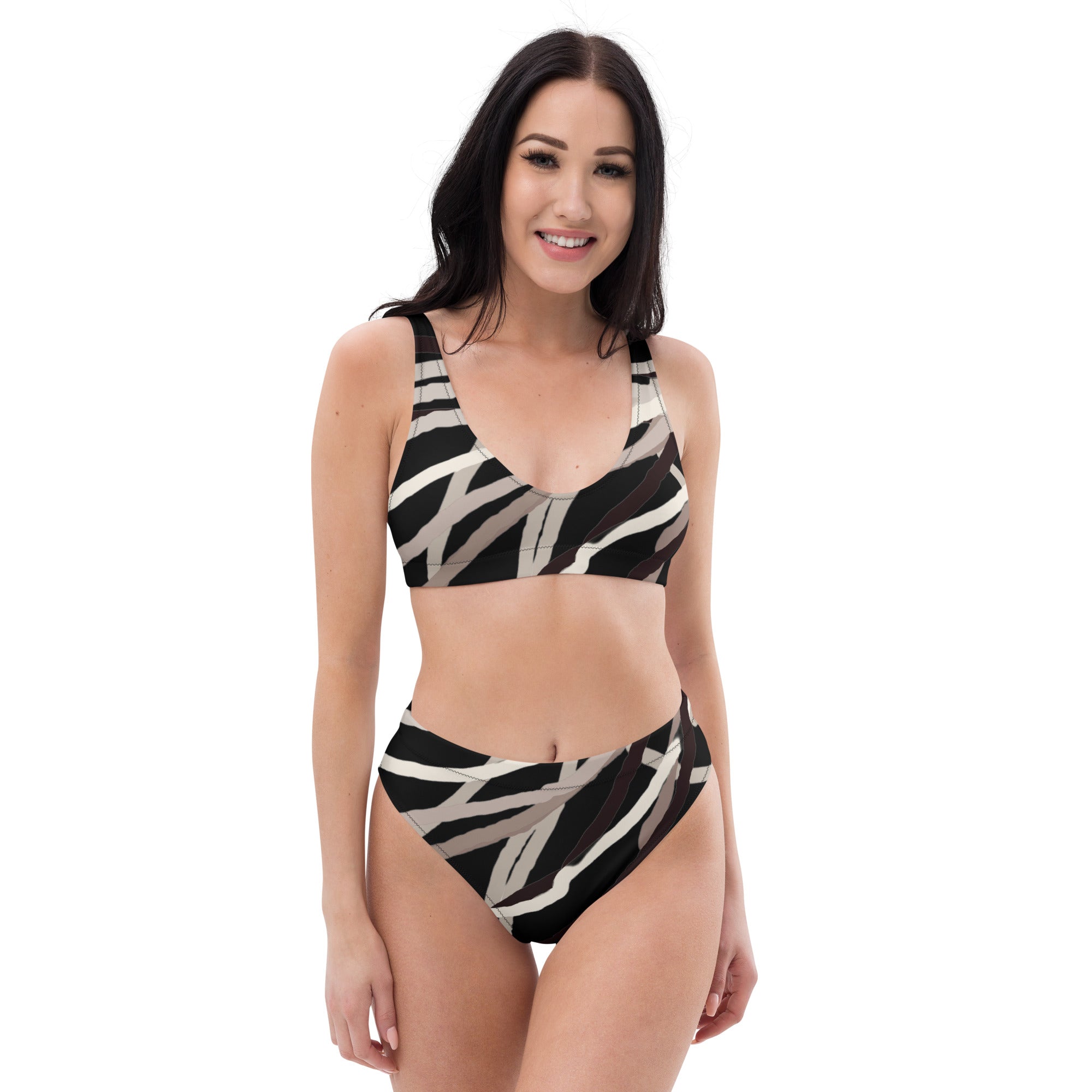 Front view eco-friendly abstract high-waisted bikini set in black and neutral tones on model.