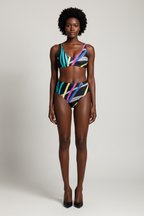 Model wearing a colorful bikini set against a plain background