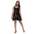 Model posing in an Apparelhue sleeveless black dress with a white butterfly pattern, ideal for summer styling.
