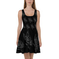 Front view of a black A-line dress with a scoop neckline and a detailed white butterfly graphic pattern.