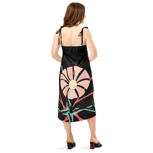Back view of the dress, highlighting the simple silhouette and the two shoulder ties.