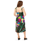 Model wearing APPARELHUE dark green slip dress featuring a bold, multi-coloured floral graphic print.
