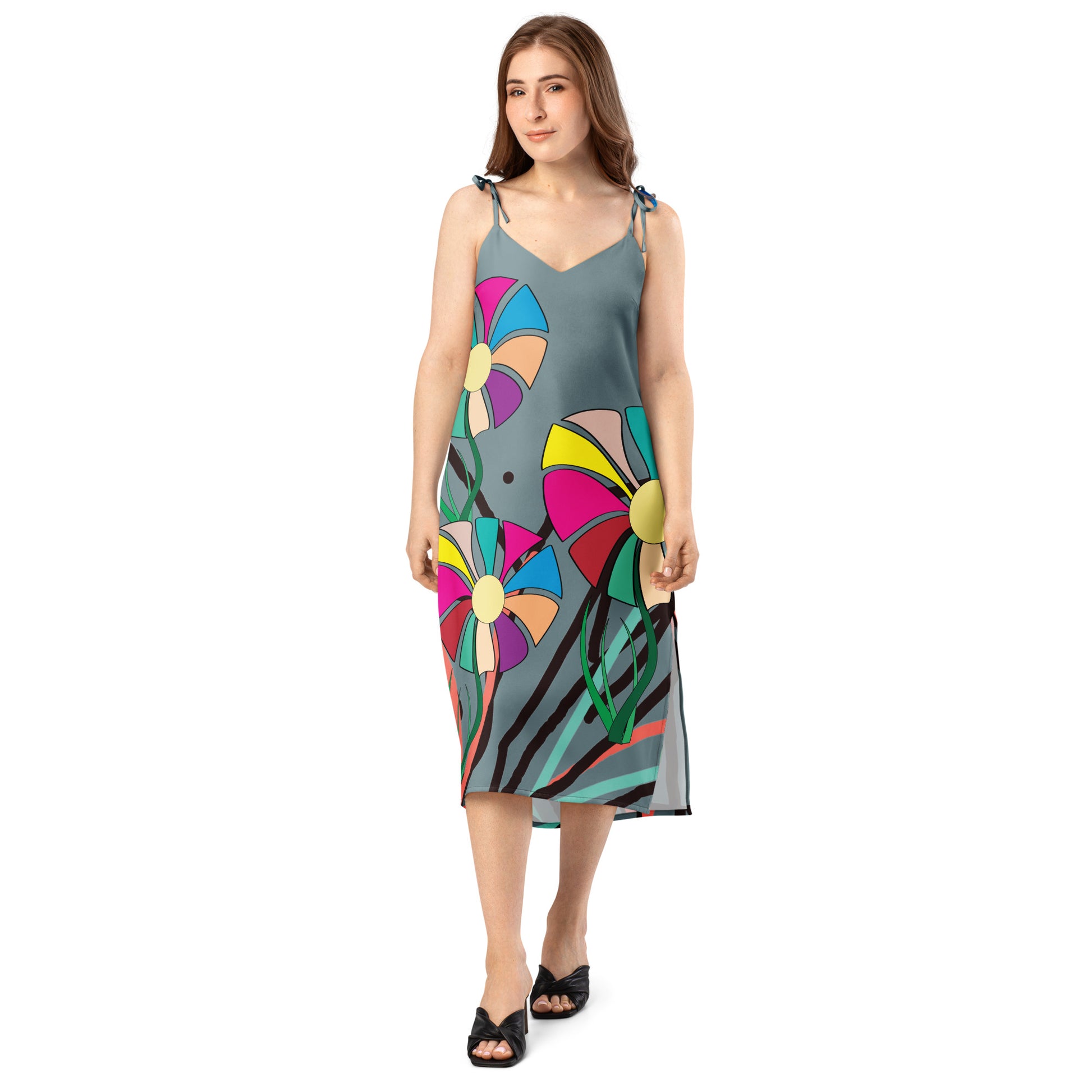 A stylish, candid shot of the woman from the side, emphasizing the dress's elegant drape and movement.