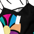 Close-up of the dress's colorful, abstract floral print on the hunter green fabric.