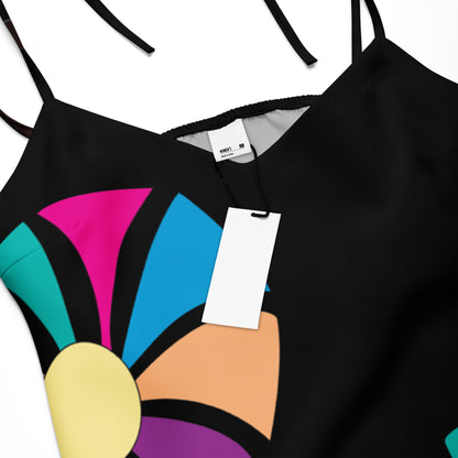 Close-up of the dress's colorful, abstract floral print on the hunter green fabric.