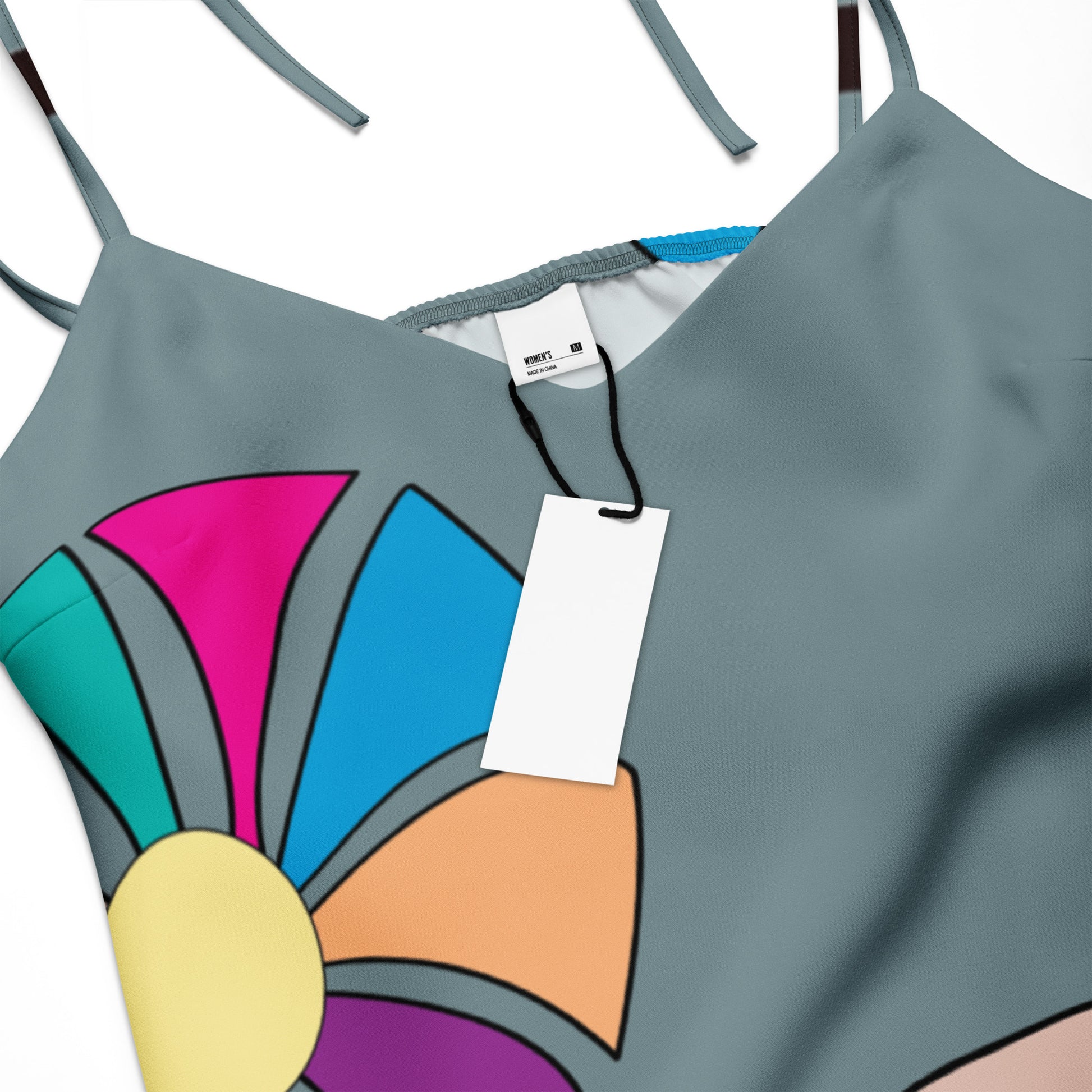 Close-up shot of the V-neckline and the vibrant patterns on the bodice.