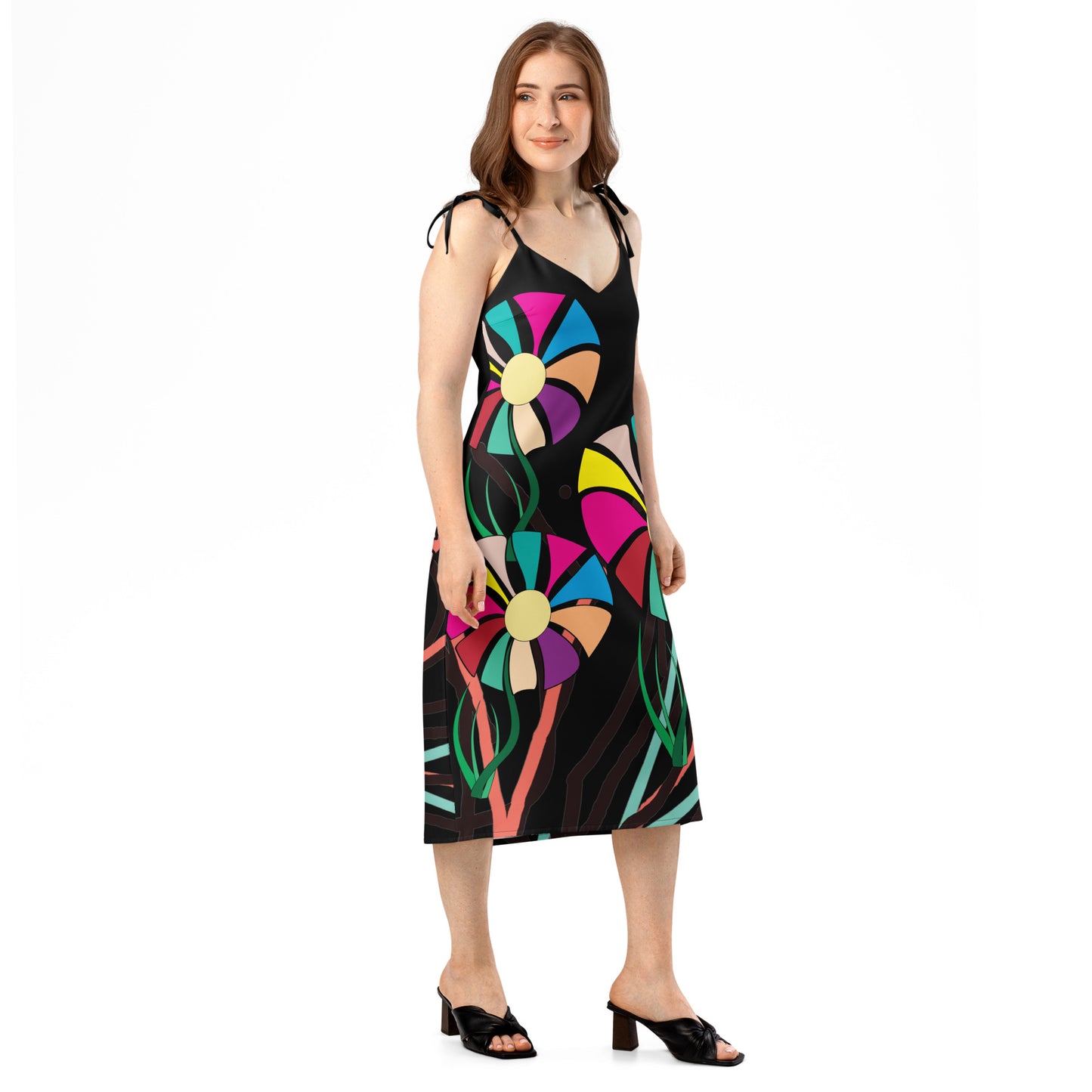 Side view of the floral print midi dress, showing the tie-strap detail and the high slit on the left leg.