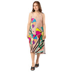 Woman wearing a colorful dress with abstract patterns on a white background