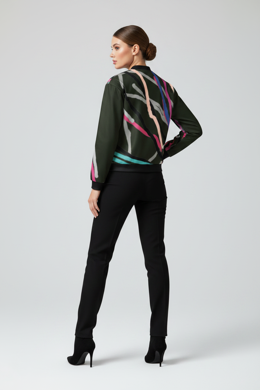 Woman wearing a stylish outfit with a colorful jacket and black pants on a white background