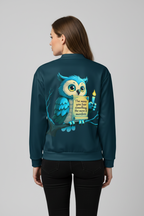 Person wearing a teal jacket with an owl design on the back
