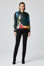 Woman wearing a colorful jacket with a graphic design on a white background