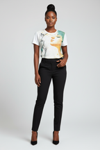 Woman wearing a graphic t-shirt and black pants on a white background