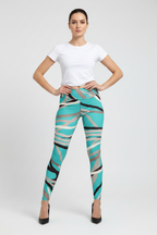 Woman wearing a white t-shirt and colorful patterned leggings on a white background