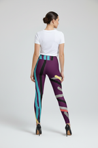 Woman wearing colorful leggings with a white background