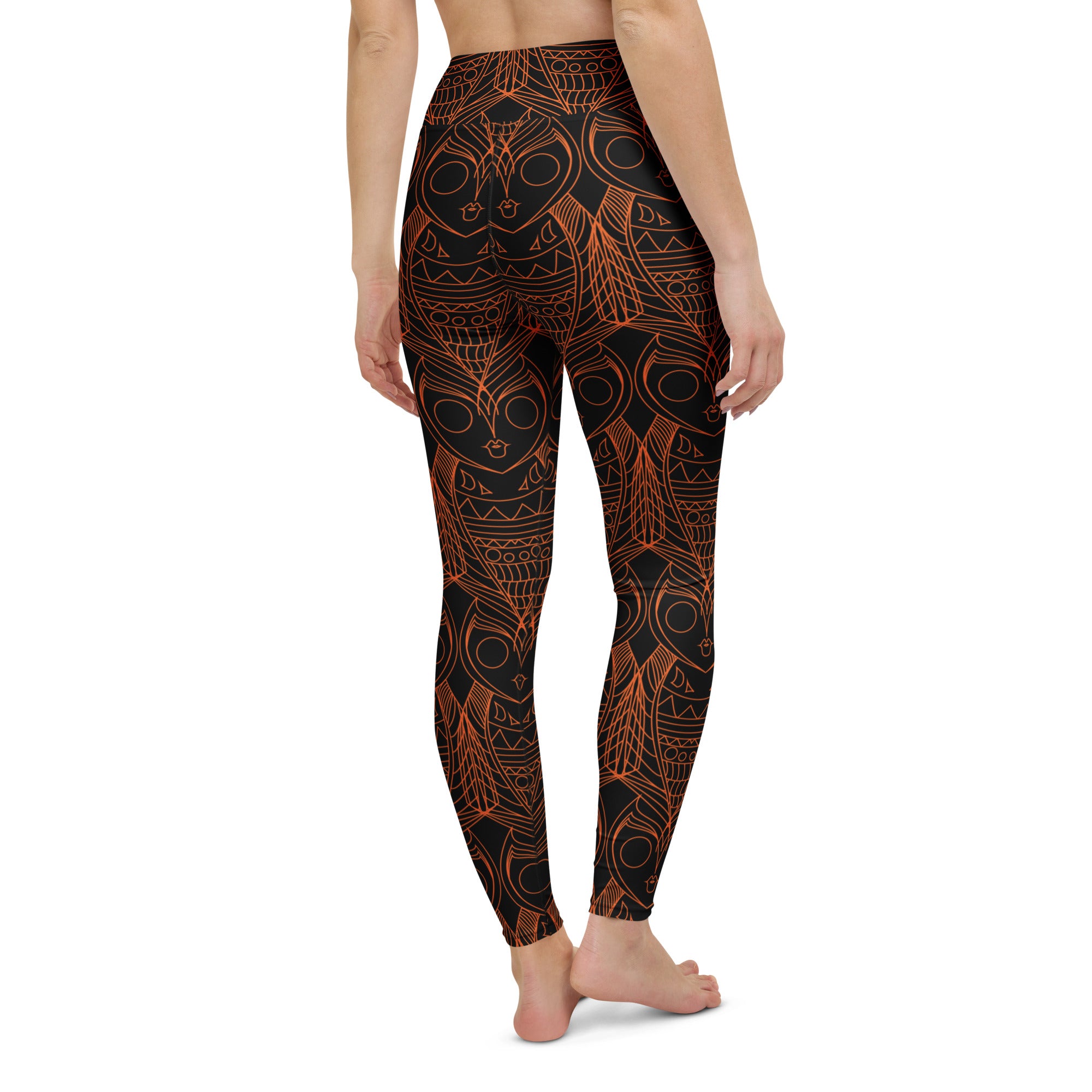Women practising yoga in owl pattern artistic leggings – dynamic pose showing fit and flexibility.
