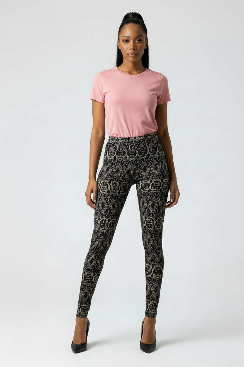 Woman wearing a pink t-shirt and patterned leggings on a white background