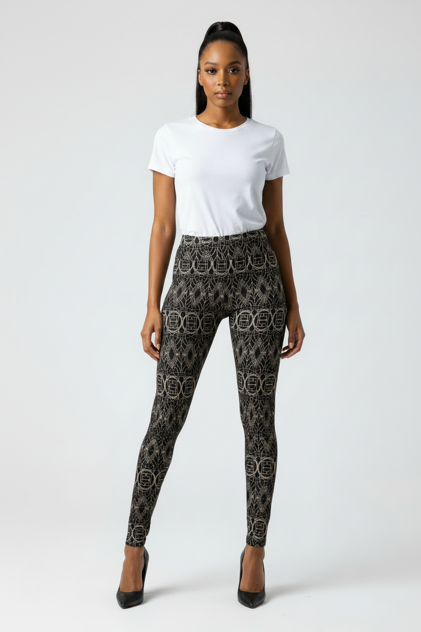 Woman wearing a white t-shirt and patterned black pants on a white background
