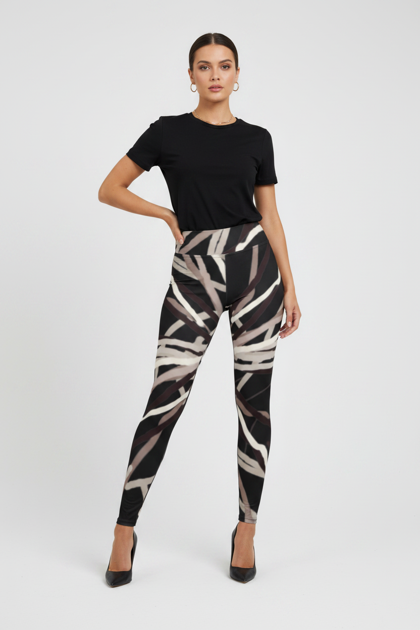Woman wearing black t-shirt and patterned leggings on a white background