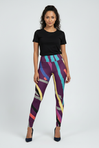 Woman wearing colorful patterned leggings with a black top on a white background