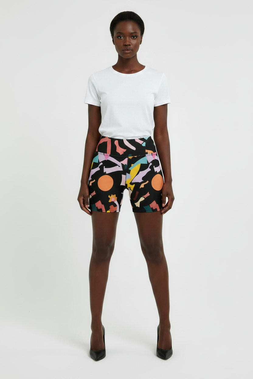 Person wearing a white t-shirt and colorful patterned shorts on a white background