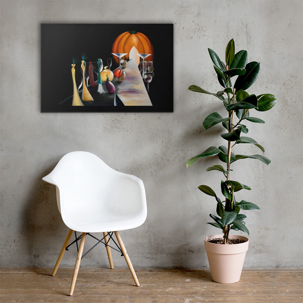 A framed wall art print depicting a still life with a large orange pumpkin, wine glasses, and colorful bottles on a dark background, displayed above a white molded chair next to a potted fiddle-leaf fig plant against a textured gray wall.