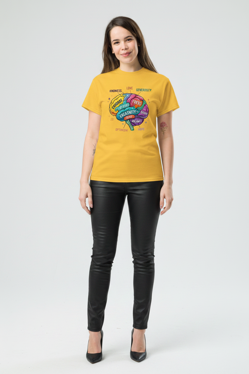 Woman wearing a yellow t-shirt with a colorful graphic design on a white background