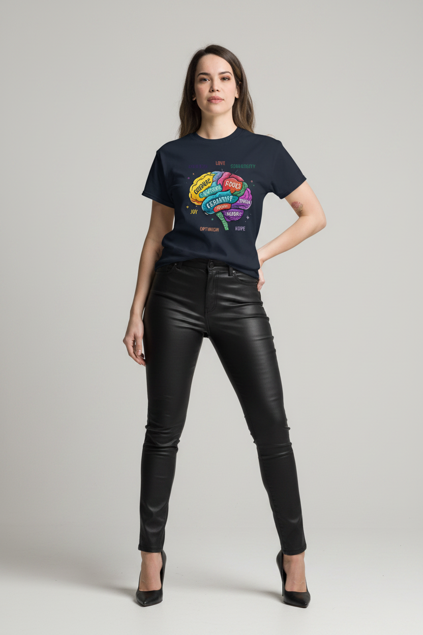 Person wearing a black t-shirt with colorful graphics and black leather pants on a light gray background