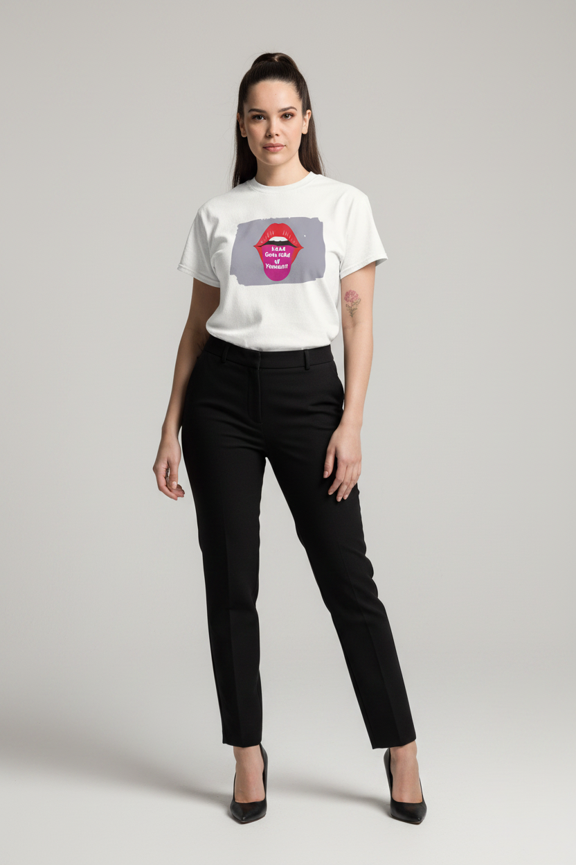 A woman modeling a white short-sleeve graphic T-shirt with a gray square print featuring red lips and the text 'DON'T BE A IDOL', paired with black trousers and black heels, against a light gray studio background.
