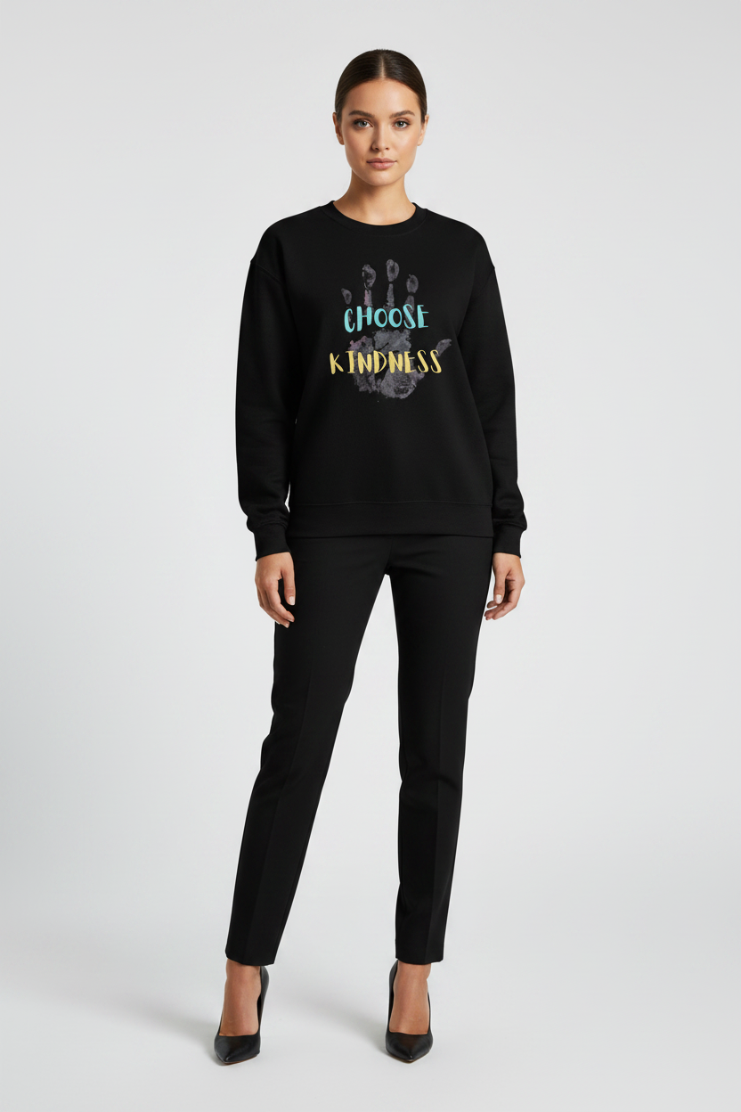 Woman wearing a black sweatshirt with a paw print design and text on a white background