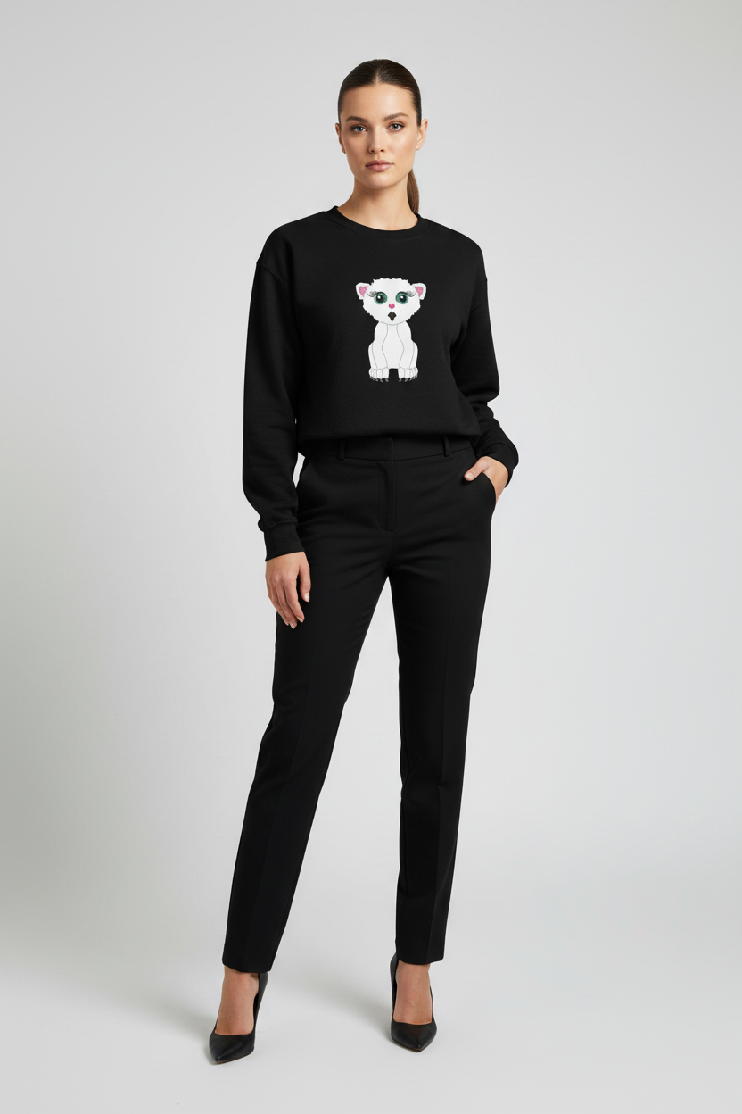 Woman wearing a black sweater with a white bear design and black pants on a light gray background