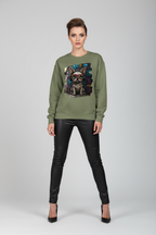 Woman wearing a green sweatshirt with a graphic design on a gray background