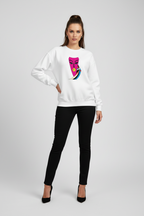 Woman wearing a white sweatshirt with a colorful graphic design on a plain background