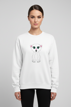 Woman wearing a white sweatshirt with a cartoon polar bear design on a gray background