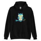 Front view of black unisex heavy blend hoodie featuring a white owl graphic and manifestation quote.