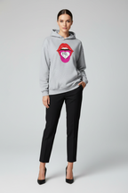 A gray hoodie with a pink and purple graphic of a mouth and the text 'BE KIND TO YOURSELF' on the front.