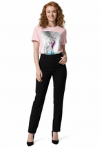 Woman wearing a pink graphic t-shirt and black pants on a white background