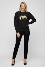 Woman wearing a black sweatshirt with a graphic design on a white background