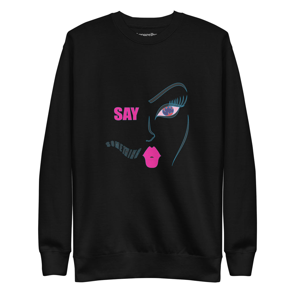 Black sweatshirt with a graphic print of a female face and lips in pink on the front, with the text 'SAY SOMETHING' below.