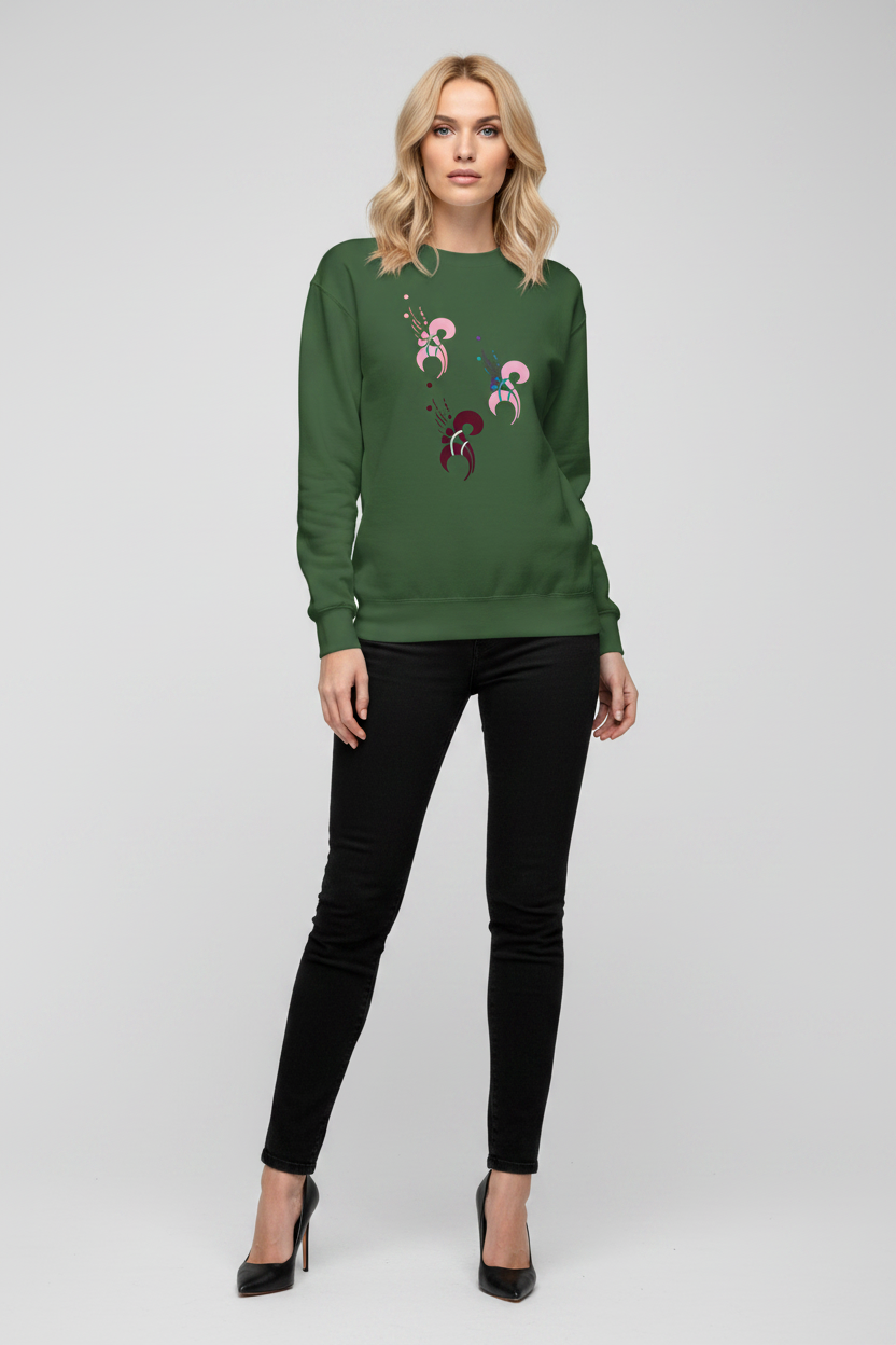 Woman wearing a green sweater with embroidery and black pants on a white background