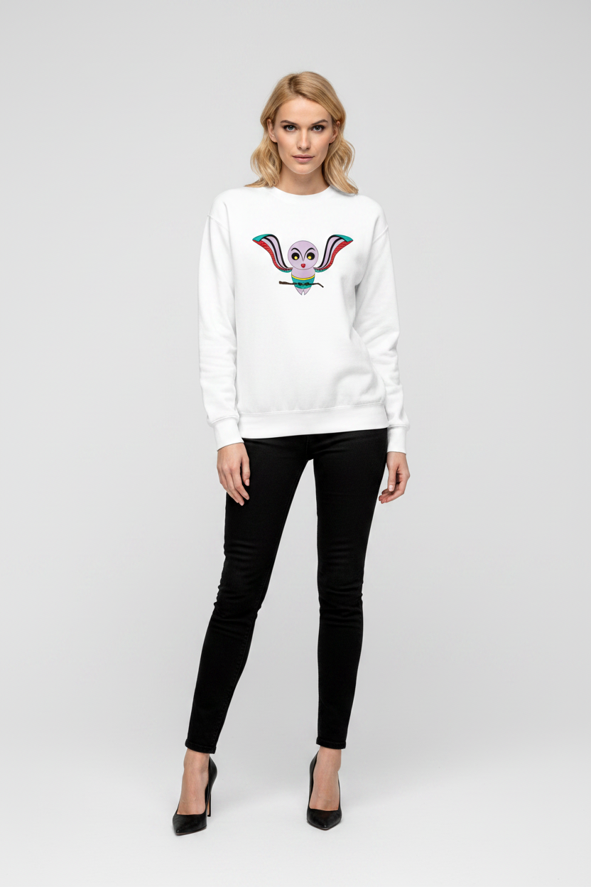 Woman wearing a white sweater with a colorful design on a plain background