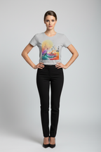 Woman wearing a gray t-shirt with a colorful graphic design and black pants on a white background