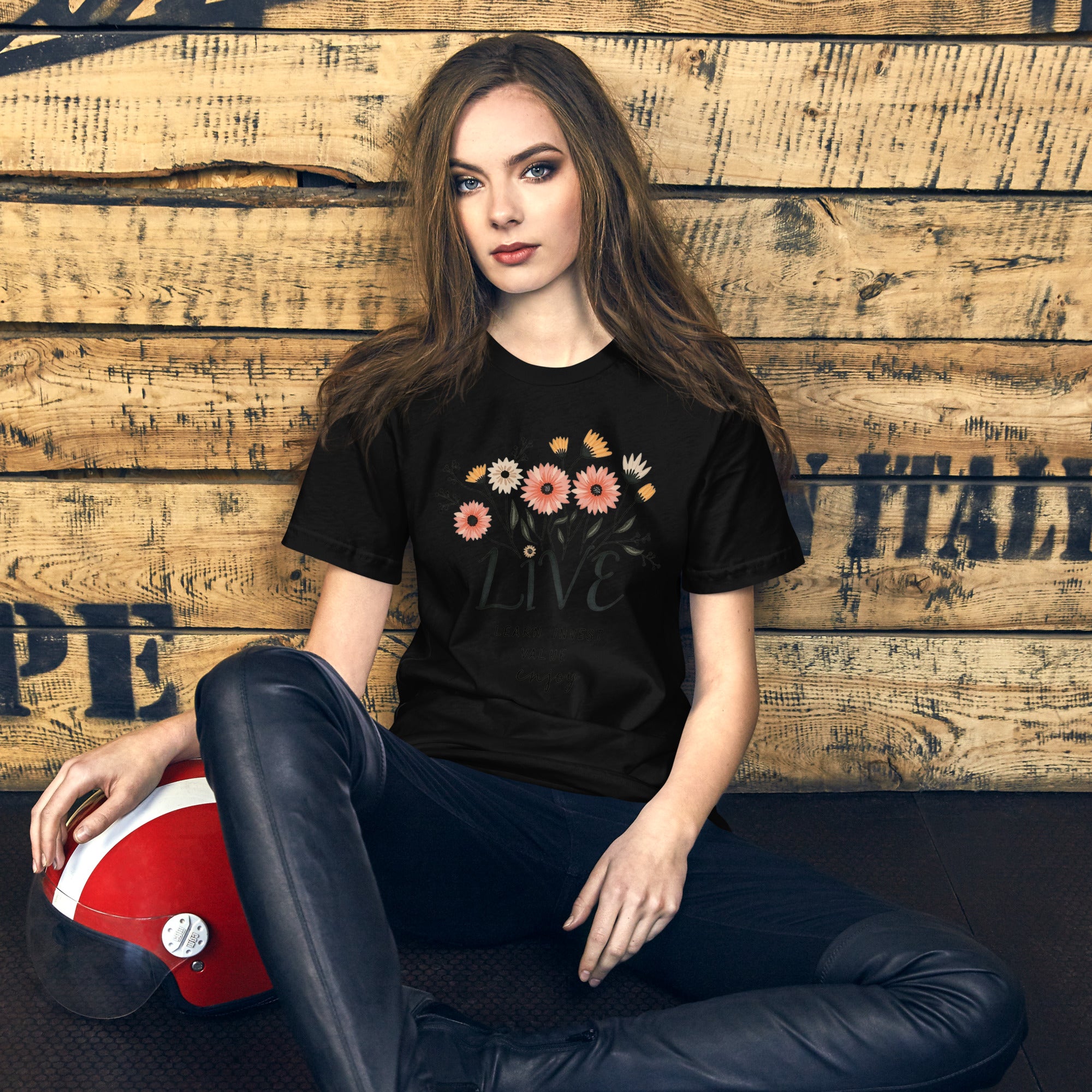 Inspirational graphic tee folded with phrase LIVE Learn Invest Value Enjoy