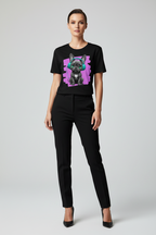 Woman wearing a black t-shirt with a graphic design of a dog on a white background