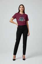 Woman wearing a maroon t-shirt with 'Choose Kindness' text on a plain background