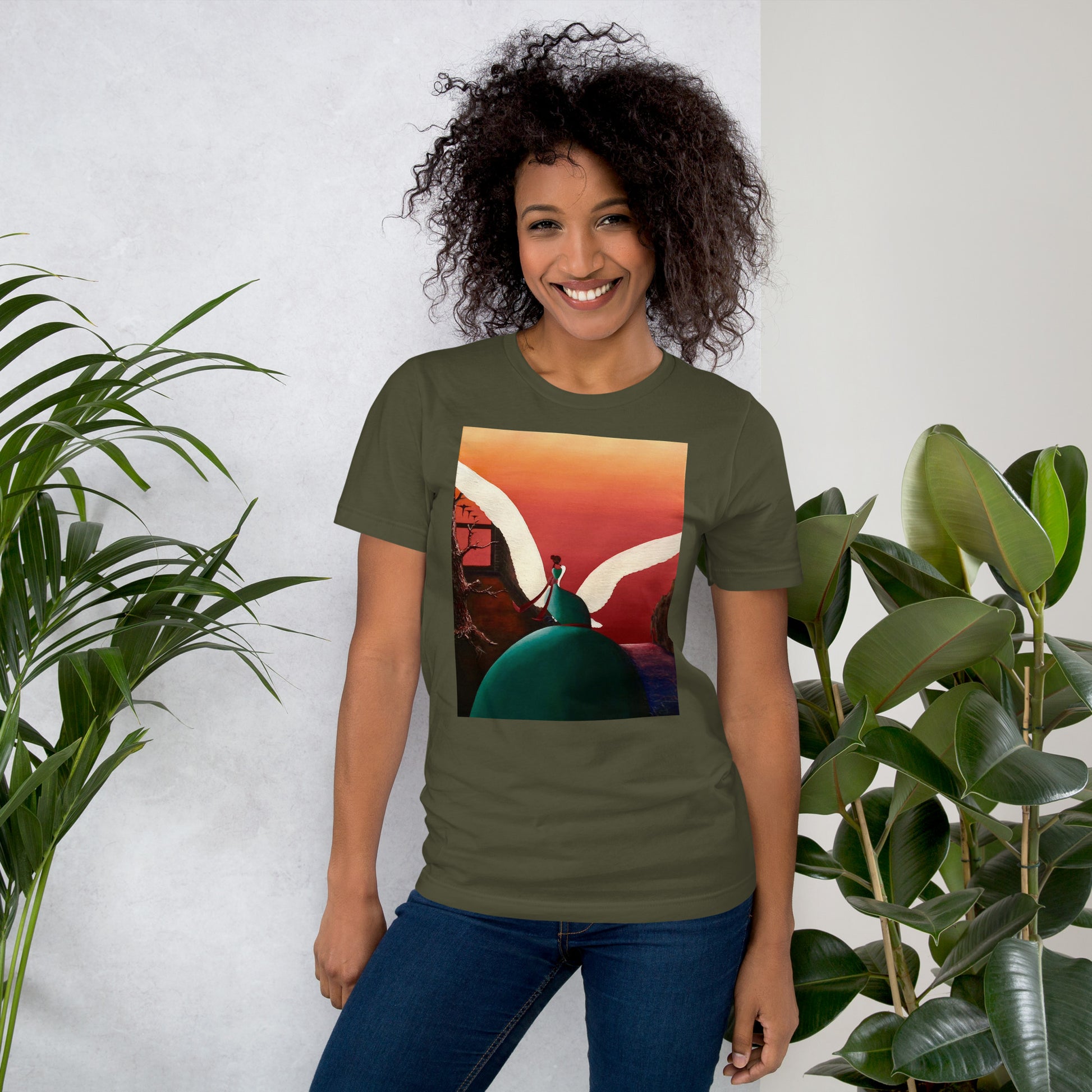 A close-up shot of the graphic print, featuring a winged human figure and a colorful landscape.