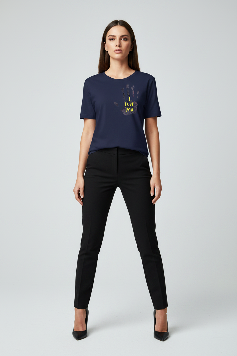 Woman wearing a navy blue t-shirt with a graphic design on a white background