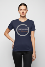 Woman wearing a navy blue t-shirt with text on a light gray background