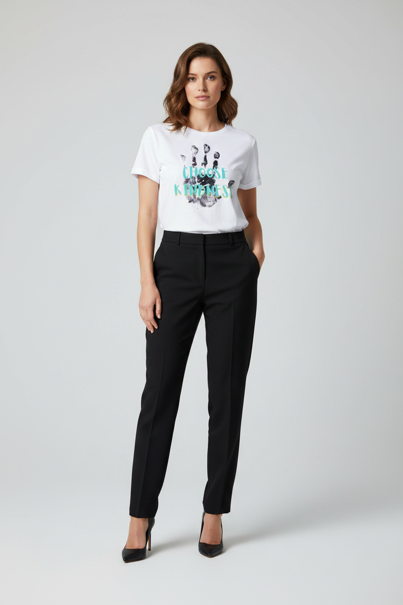 Woman wearing a white t-shirt with text and black pants on a white background
